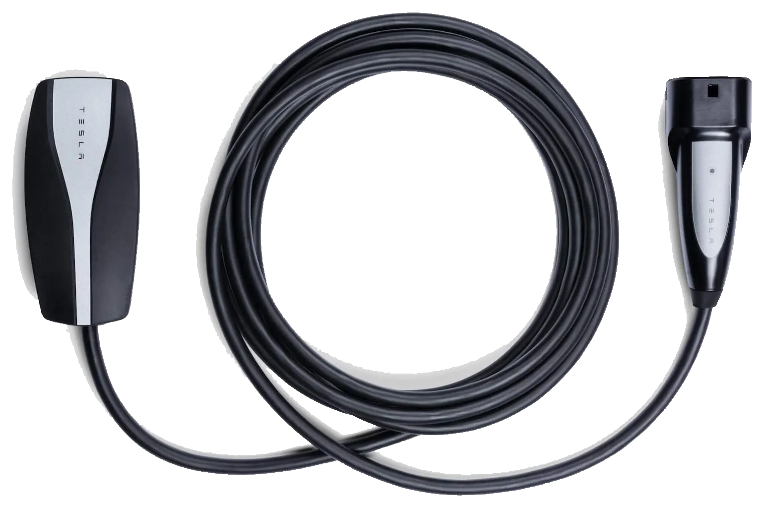 A Tesla Mobile Connector laid flat: a black controller carrying the Tesla wordmark on the left, six metres of black cable coiled in the middle, and the Type 2 handle on the right