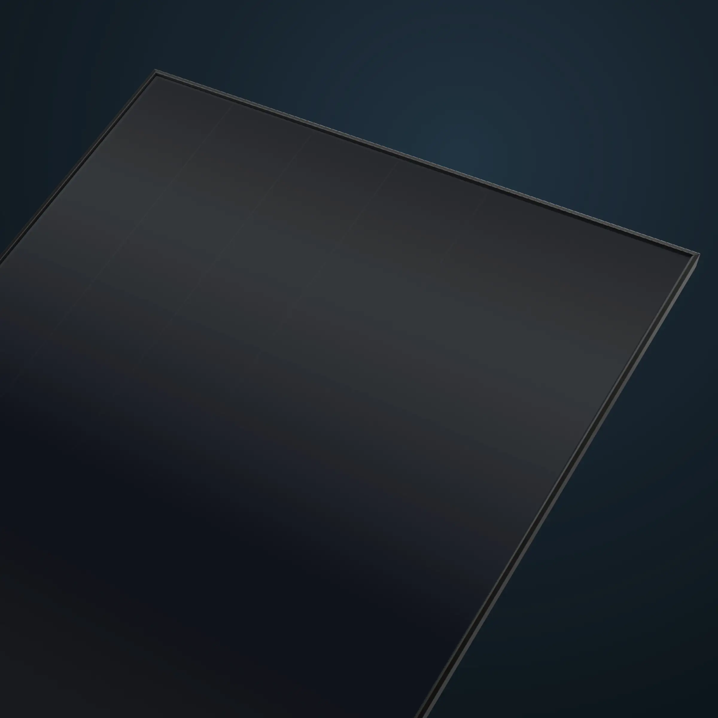 The top corner of a black glass solar panel in a thin black frame, seen at an angle against a dark blue ground